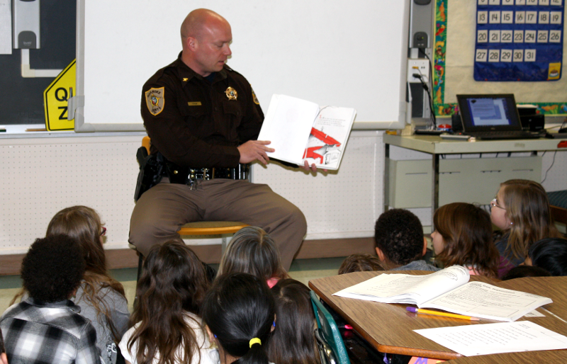 Sheriff Orange Reading Book to Students