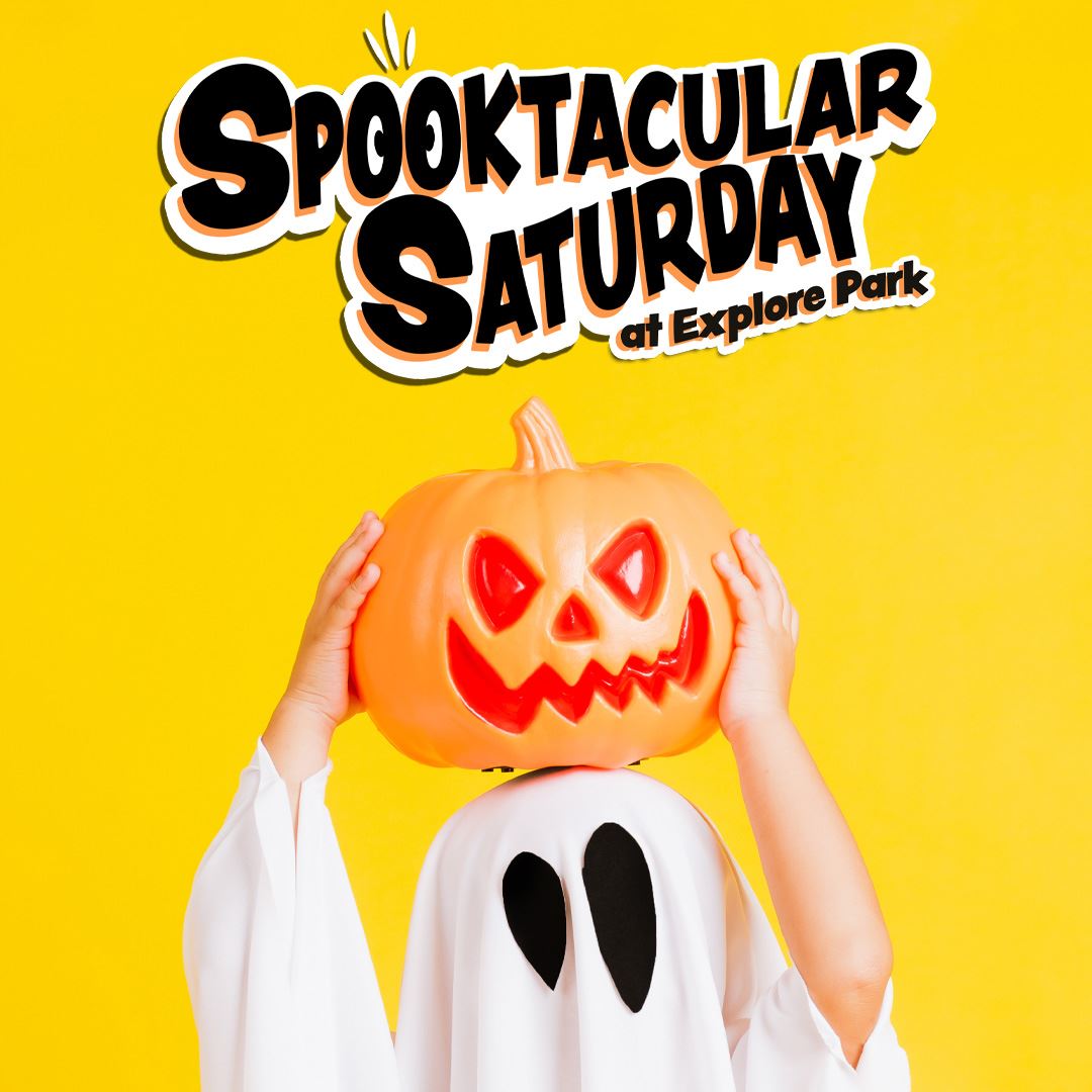 A ghost holds a pumpkin