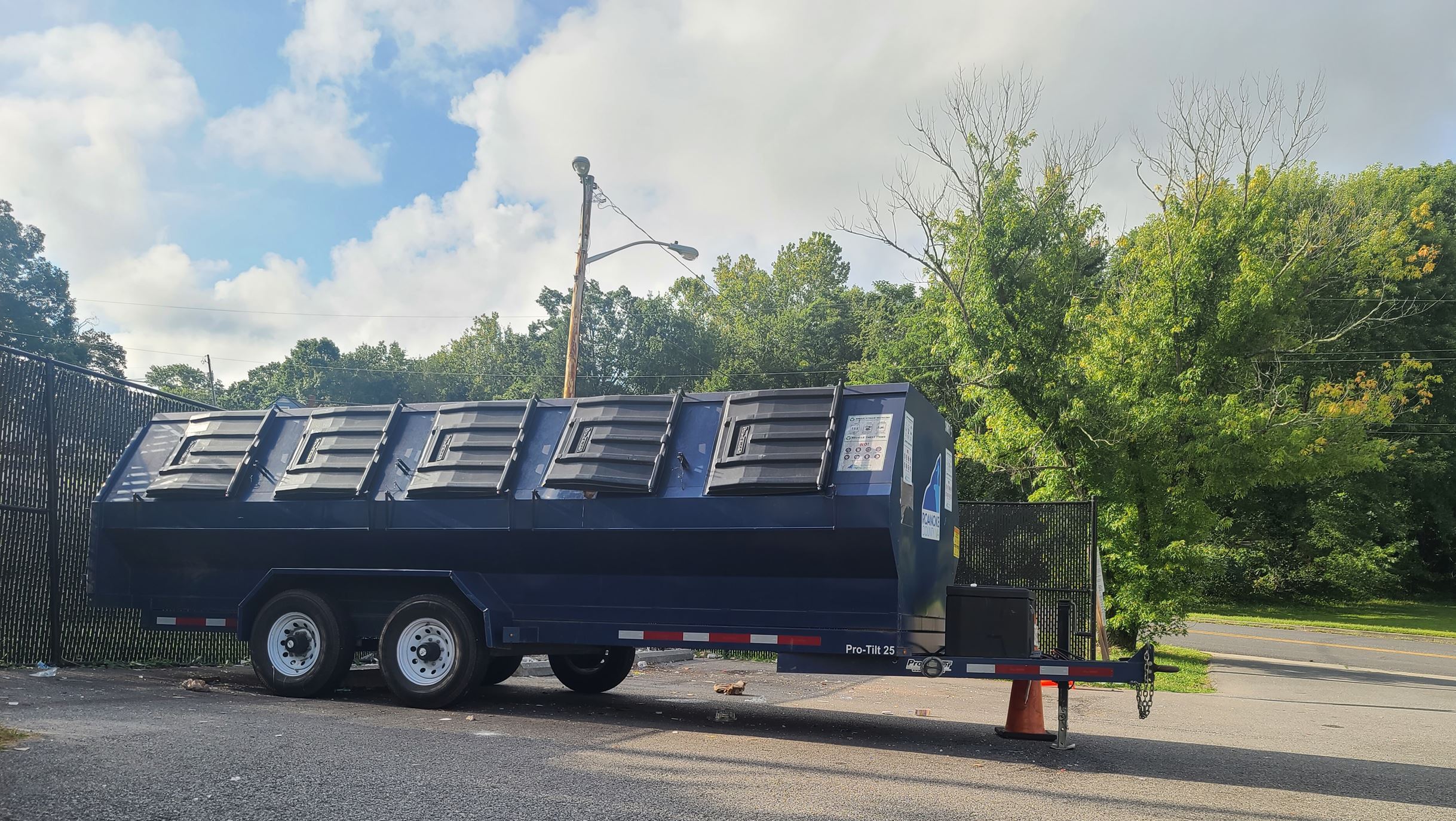 Recycle Trailer - Brambleton - Parking Lot in Front of Black Fenced Area