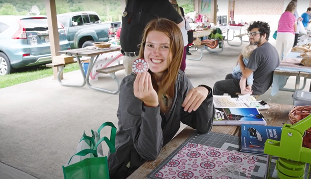 Making a button at the Catawba Valley Farmer's Market